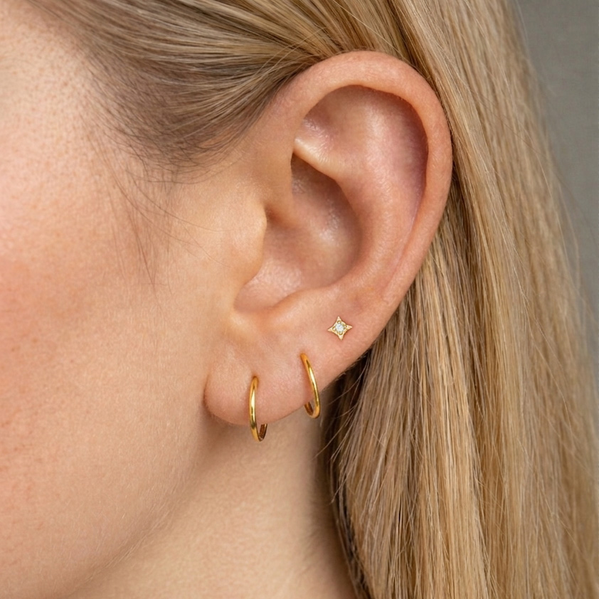 Aritos de 12mm con piercing estrella